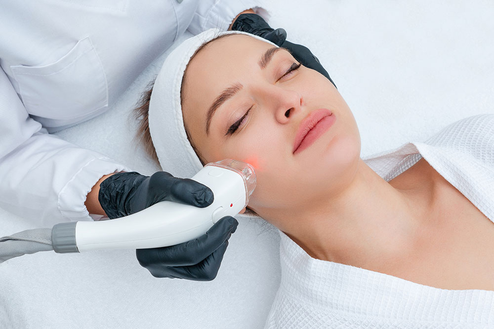 young-woman-receiving-laser-treatment-cosmetology-clinic